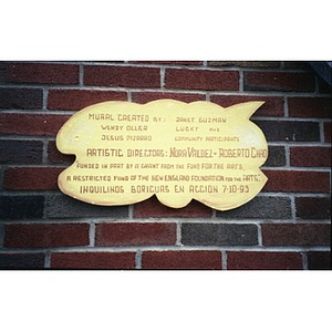 Plaque naming creators of On the Wall mural.