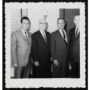 Group portrait of the Board of Overseers members, including William J. Lynch, standing third from left