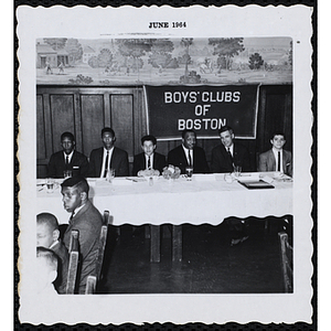 "Boy of the Year," Oswald Gooden seated at the head table with his father and other guests at the award ceremony