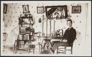 Young man with musical instruments on table