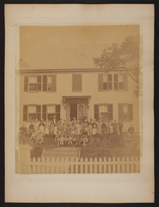 Group portrait of children in front of an unidentified school building