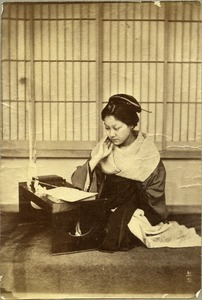 Japanese woman at calligraphy table