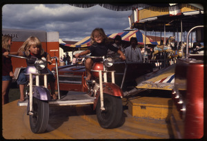 Children on a fairground carousel