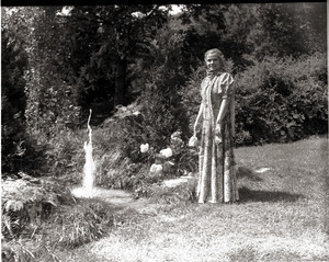 Dorothy Canfield Fisher, standing in the woods