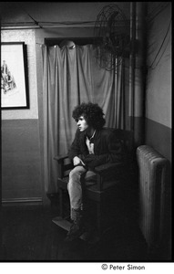 Tim Buckley at the Catacombs: Buckley backstage, seated in a chair