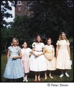 Carly Simon (center) with girls in dresses