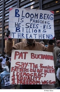 Occupy Wall Street: demonstrator obscured by the two signs he's holding