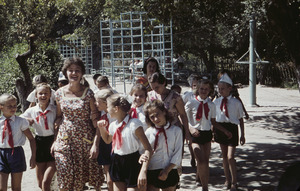 Children with two adults in playground