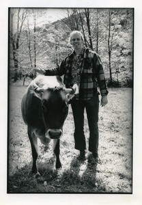 Sam Lovejoy and Jersey cow, Montague Farm Commune