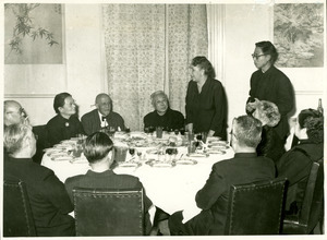 Shirley Graham Du Bois speaking to her table at dinner, China 1959