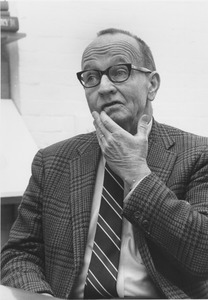 Hugh F. Bell sitting indoors