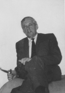 Thomas Wellsted Copeland sitting indoors with his legs crossed