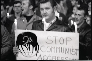 Young Americans for Freedom pro-Vietnam War demonstration, Boston Common: Man holding sign reading "Stop Communist aggression"