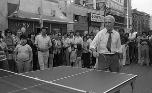 Mayor Kevin White plays table tennis at the 1979 August Moon Festival