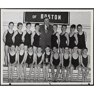 Boys' Clubs of Boston swim team posing with their trophy and an unidentified man