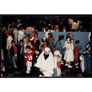 Children in costumes attend a Halloween event