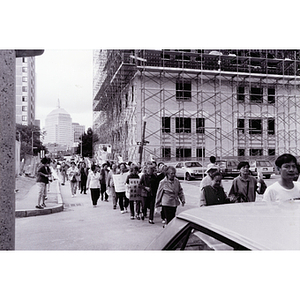 Demonstrators march past Ash Street to protest against the New England Medical Center's proposal to build a garage on Parcel C