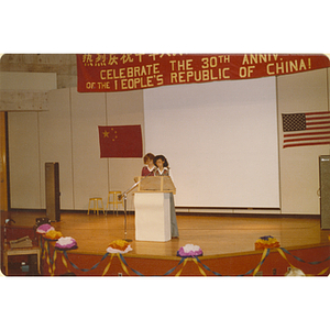 Speaker at the 30th anniversary celebration of the People's Republic of China, held in the Josiah Quincy School auditorium