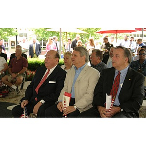 Three men sit in the audience at the Veterans Memorial groundbreaking ceremony