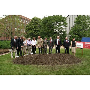 Eleven people stand ready to break ground for the Veterans Memorial