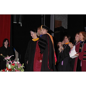 Faculty and students on stage at the School of Nursing convocation ceremony