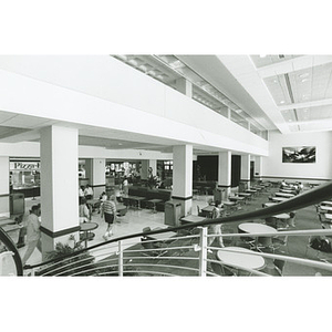 Students and tables in the food court of the Curry Student Center