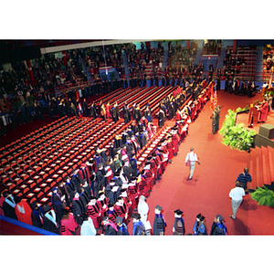 Robed guests enter Matthews Arena during the inauguration of President Freeland