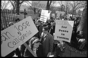 Protesters outside the White House marching against the war in Vietnam, carrying signs reading 'Clergy for peace in Vietnam,' and woman carrying a sign: 'San Jose California': Washington Vietnam March for Peace