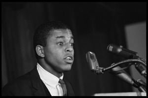 Ezell Blair [Jibreel Khazan] (?) speaking at a podium at the Youth, Non ...