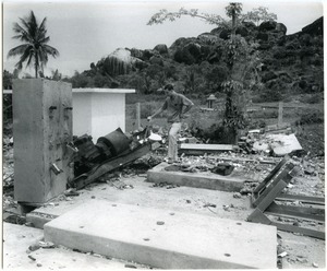 David Entin looking at generator blown up by Viet Cong