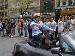 Grand Marshal Kate Clinton in her car during the Pride Parade; Main Street, Northampton, Mass.
