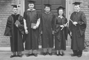 Graduates pose outside after commencement exercises