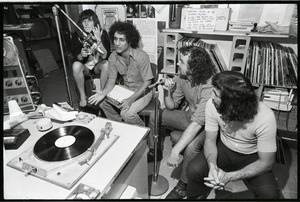 Abbie Hoffman: unidentified woman, Hoffman, George Kimball, and Bruce McCabe(?) in WBCN studio (left to right)