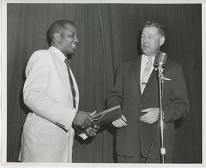 Willis C. Gorthy handing plaque to unidentified man at Institute Day