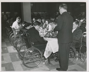 Clients in prayer at a Christmas celebration