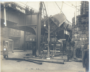 Forest Hills wreck, view from street of car hanging from tracks