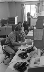 Unidentified call center workers in Boston Police Dispatch Operations Center