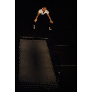 Young man jumping on a trampoline