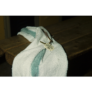 Towel and keys on a locker room bench