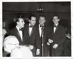 Four unidentified men singing