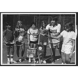 Group of children and young adults in a tennis lesson