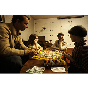 Family playing a board game