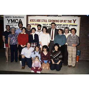 Adults and child posing for group photograph at the North Suburban YMCA