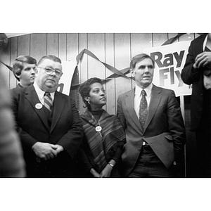 Mayor Flynn, Carmen Pola, and another man stand together at an event
