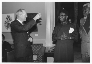 Joseph Duffey toasting Chinua Achebe