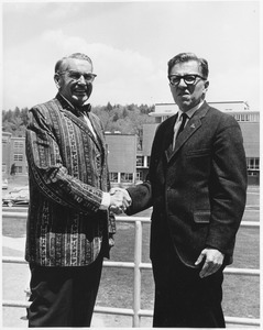 Edgar A. Perry standing with John W. Lederle