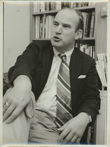 David A. Booth sitting indoors