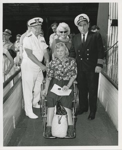 Woman in wheelchair on ramp