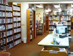 Heath Free Public Library: interior with reading area and book stacks