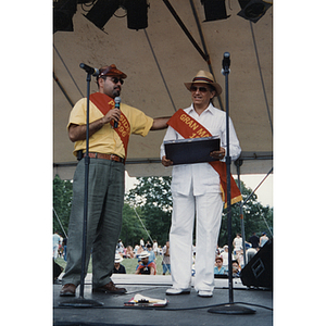 The President and Grand Marshal of the Festival Puertorriqueño stand on stage